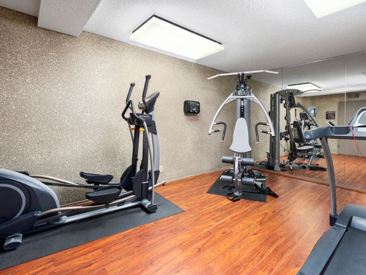 Apartments for Rent in North Hollywood - Community Fitness Center with Mirror Wall, Treadmill, Weights Machine and Elliptical.