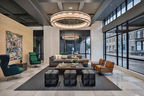 Lobby at Quarter Ohio City apartment building with chandelier and seating