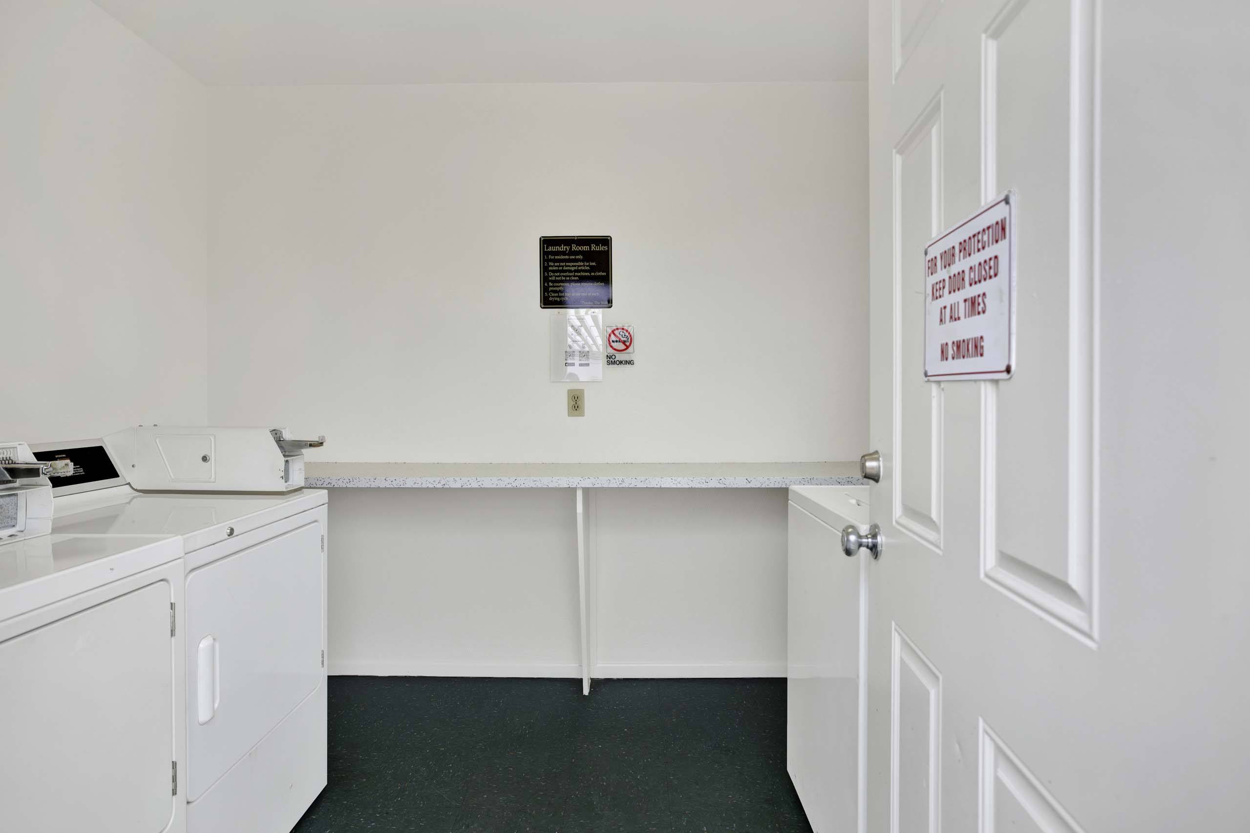 A white door with a sign on it.