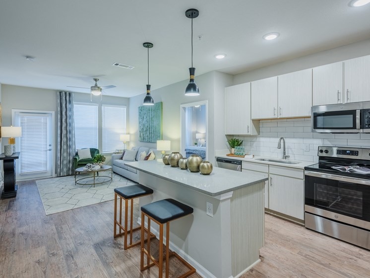 Bon Haven apartment kitchen with custom cabinets, large island, and stainless steel appliances in Spartanburg, SC