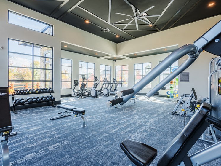 Onsite apartment building fitness center with weights and indoor cycling bikes at Bon Haven in Spartanburg, SC