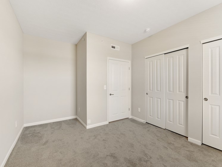 Spacious Carpeted Bedroom At Austin Place Apartments