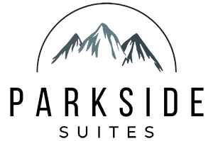 A logo with the text "Parkside Suites" and a mountain graphic above the text.