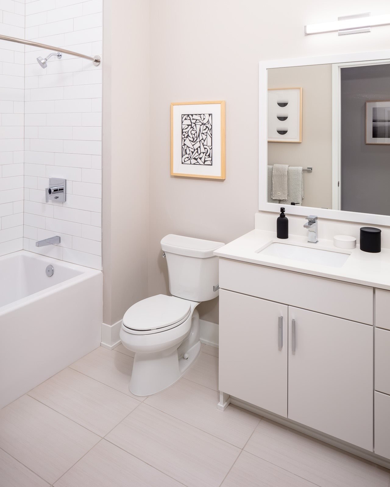 365 Nicollet Apartment Bathroom with white cabinetry and countertops