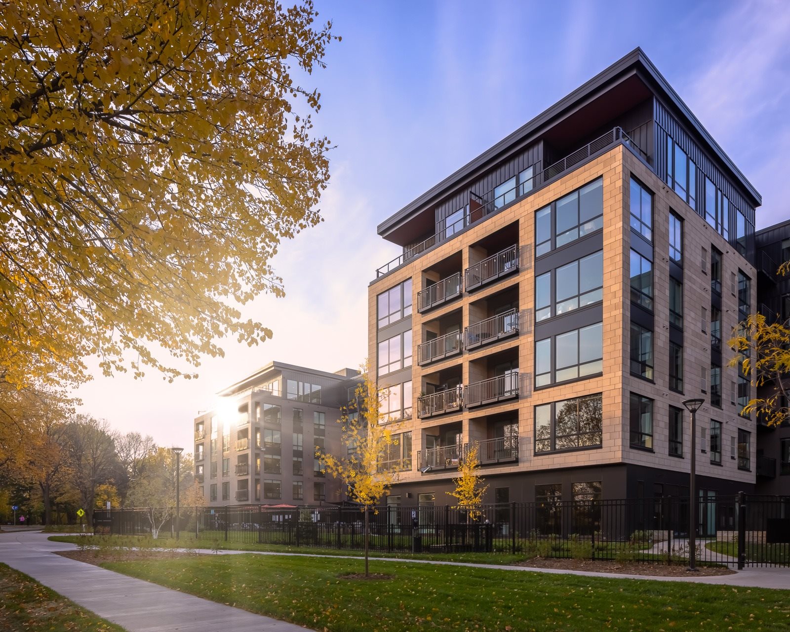 Vesi at West River Parkway with green space along river road