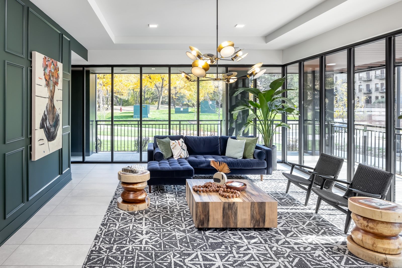 Lobby seating with floor to ceiling windows overlooking green landscaping in Minneapolis