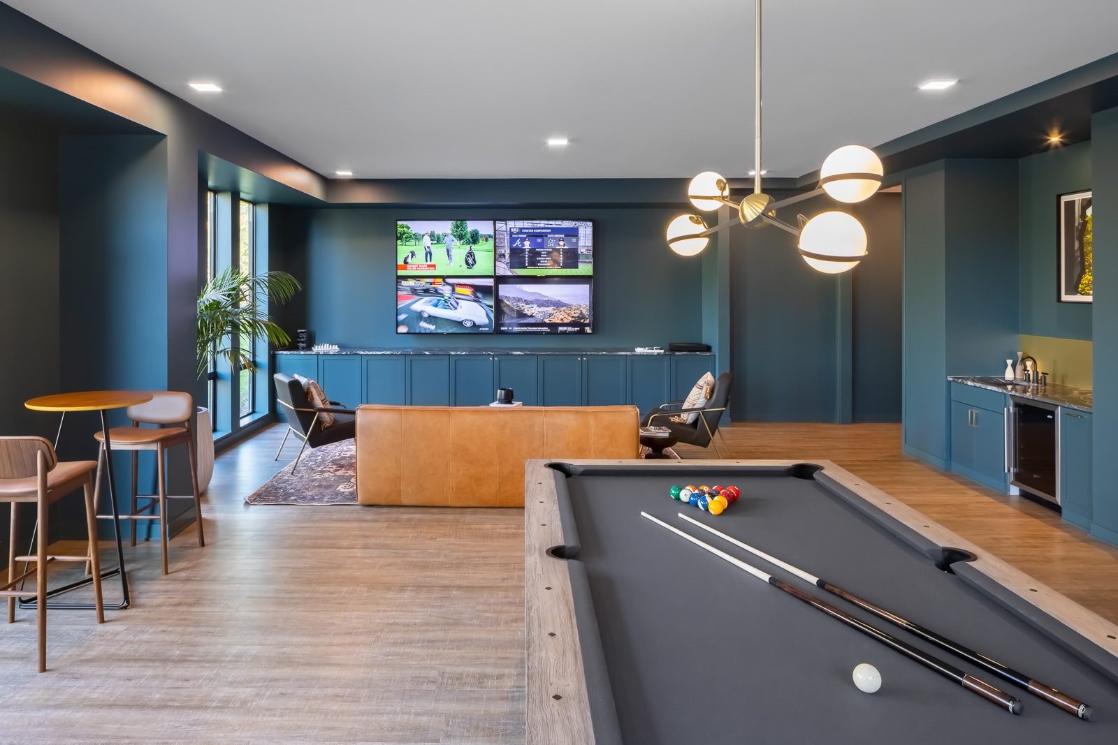 Den with pool table, wet bar, and entertainment seating