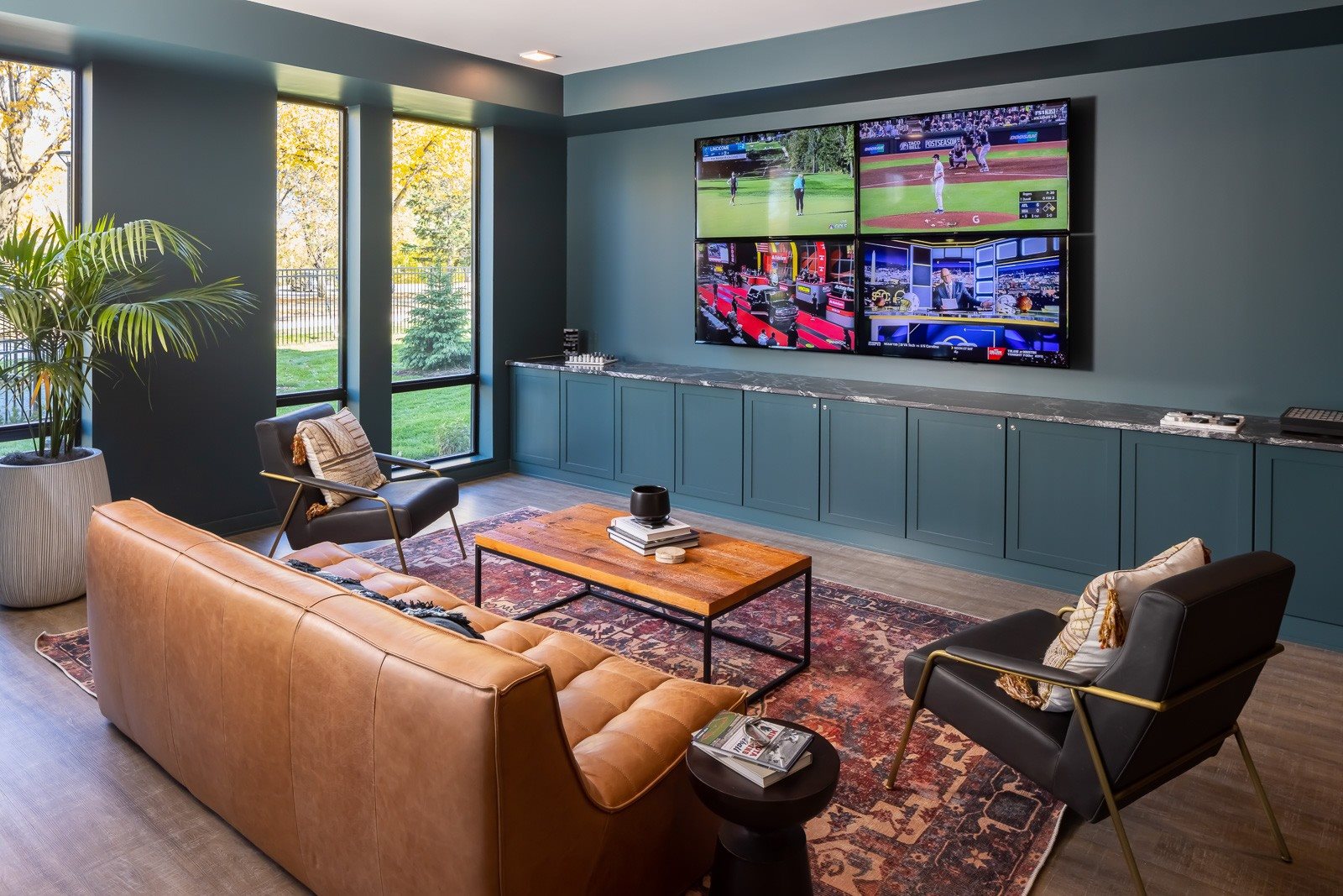 Den seating with four TV set-up
