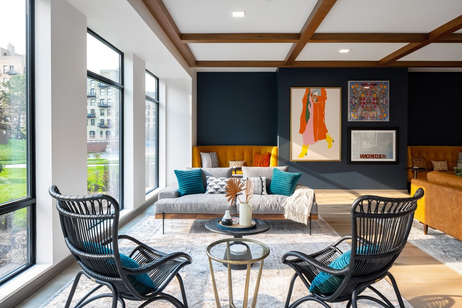 Seating in clubroom with curated art and natural light