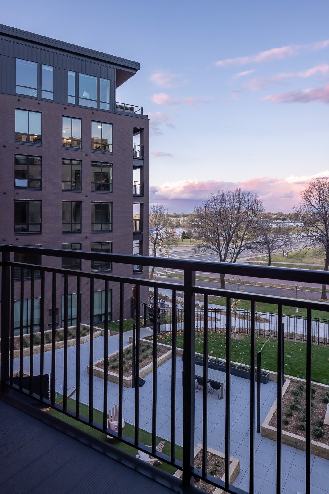 View over Mississippi river and entertaining terrace from apartment balcony