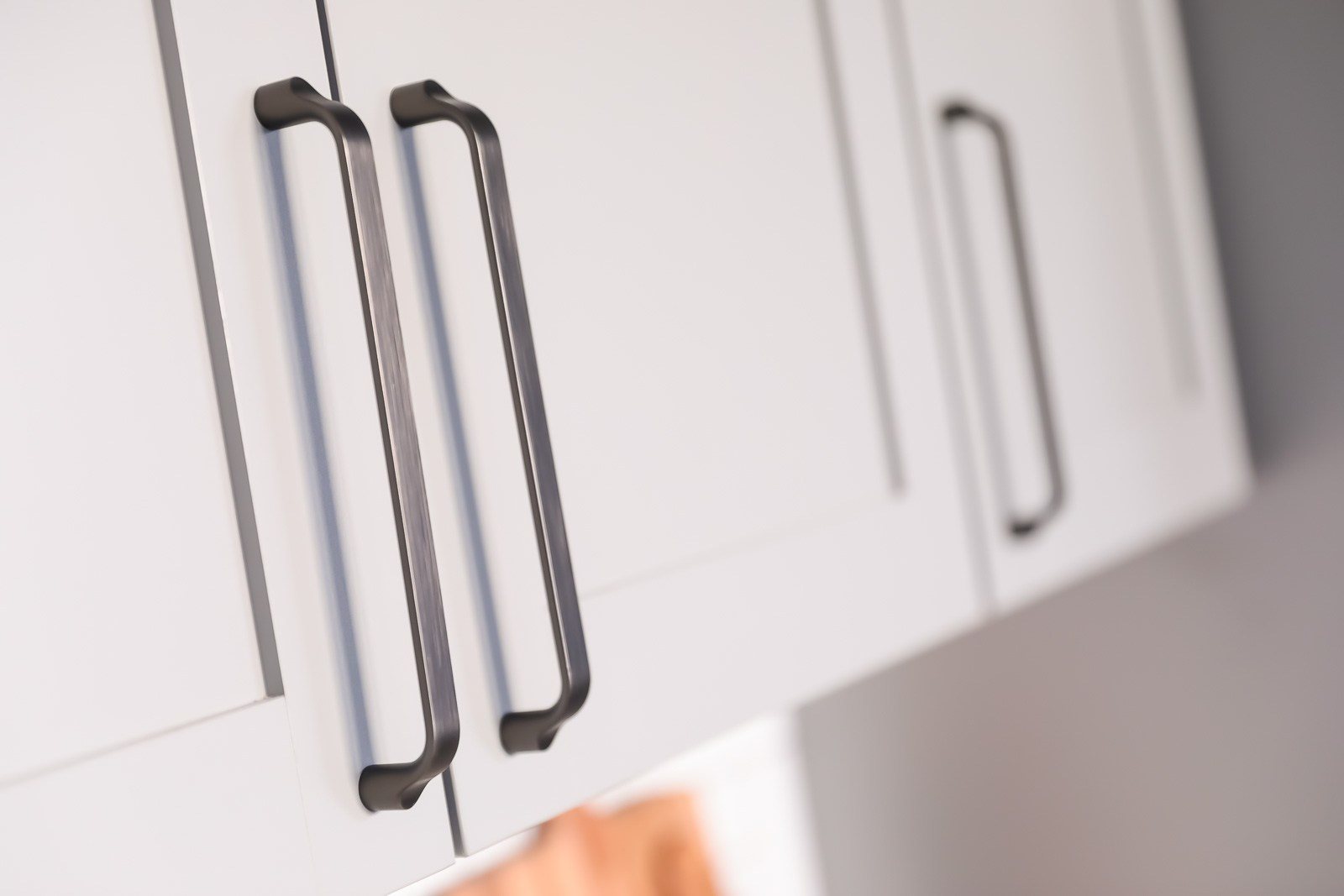 Designer cabinet pull handles on hand-crafted shaker style cabinets at Vesi