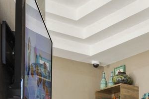 Booth seating with television on wall