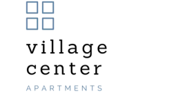 A green poster with the words "village center" and "apartments" written on it.