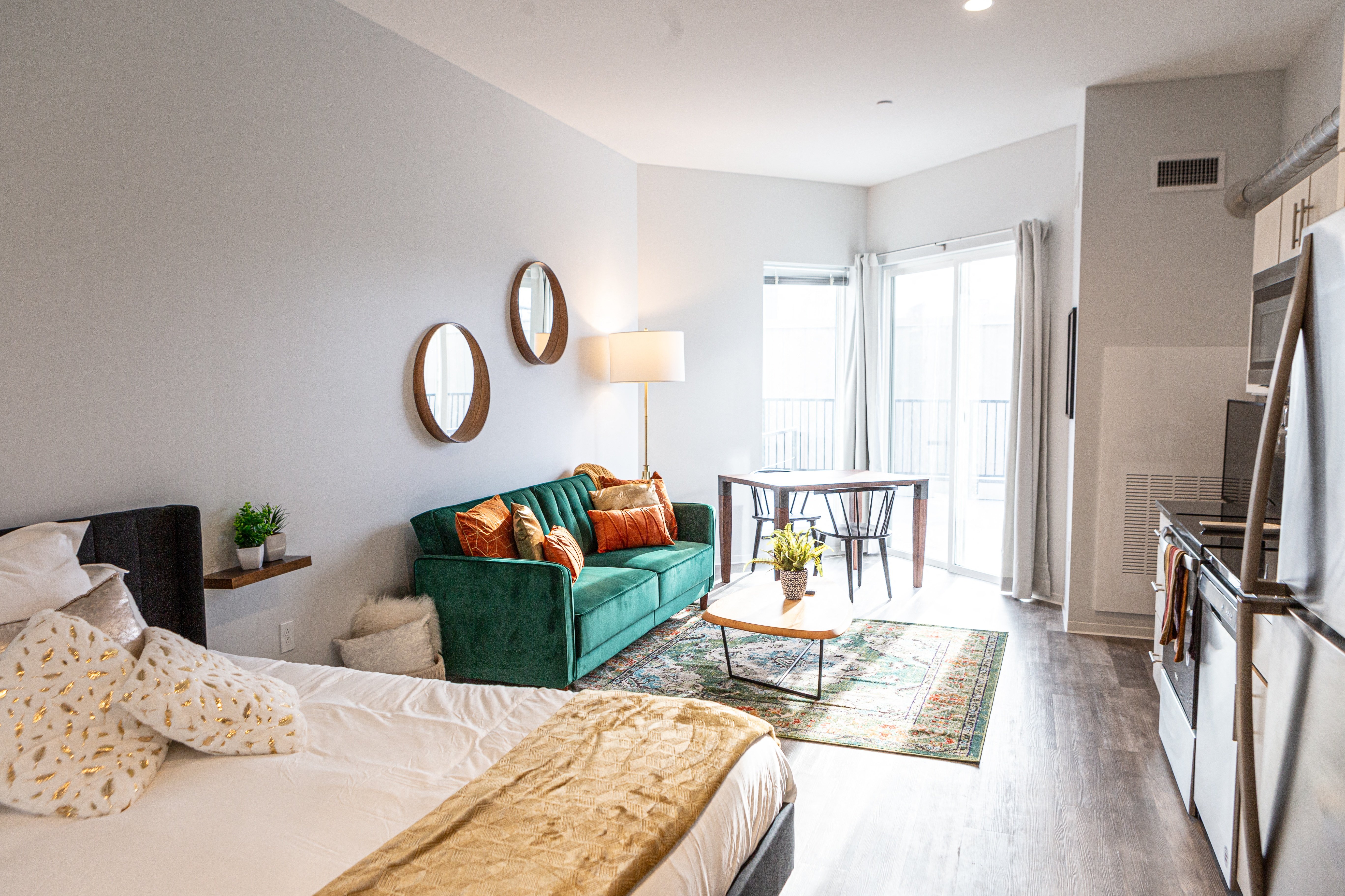 a living room with a couch and a bed