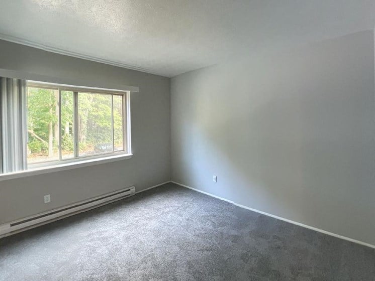 Spacious carpeted bedroom at Jordan Court Apartments, Integrity Realty, 44240
