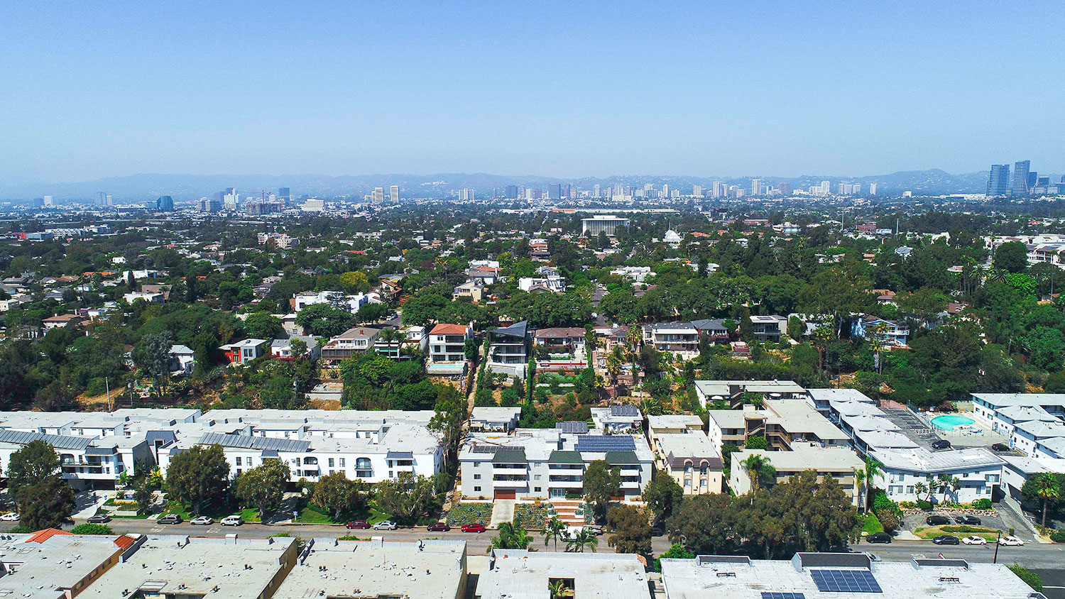 Aerial drone view of Rose North Apartments showing the Palms neighborhood of Los Angeles.