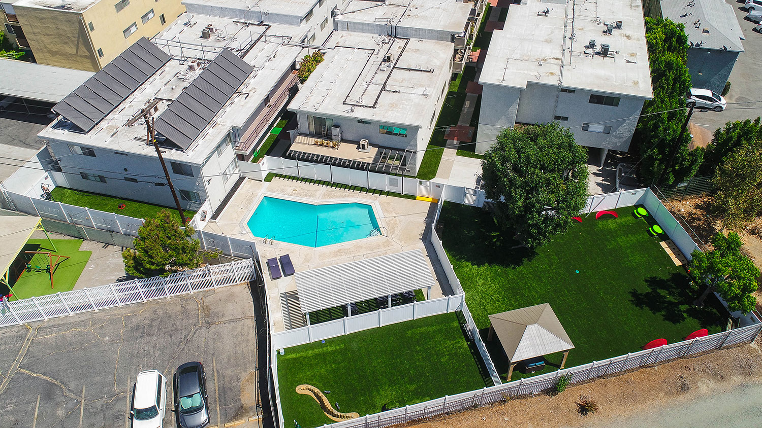 Aerial drone image of pool, pet play park, and community park at Cedar Glen.