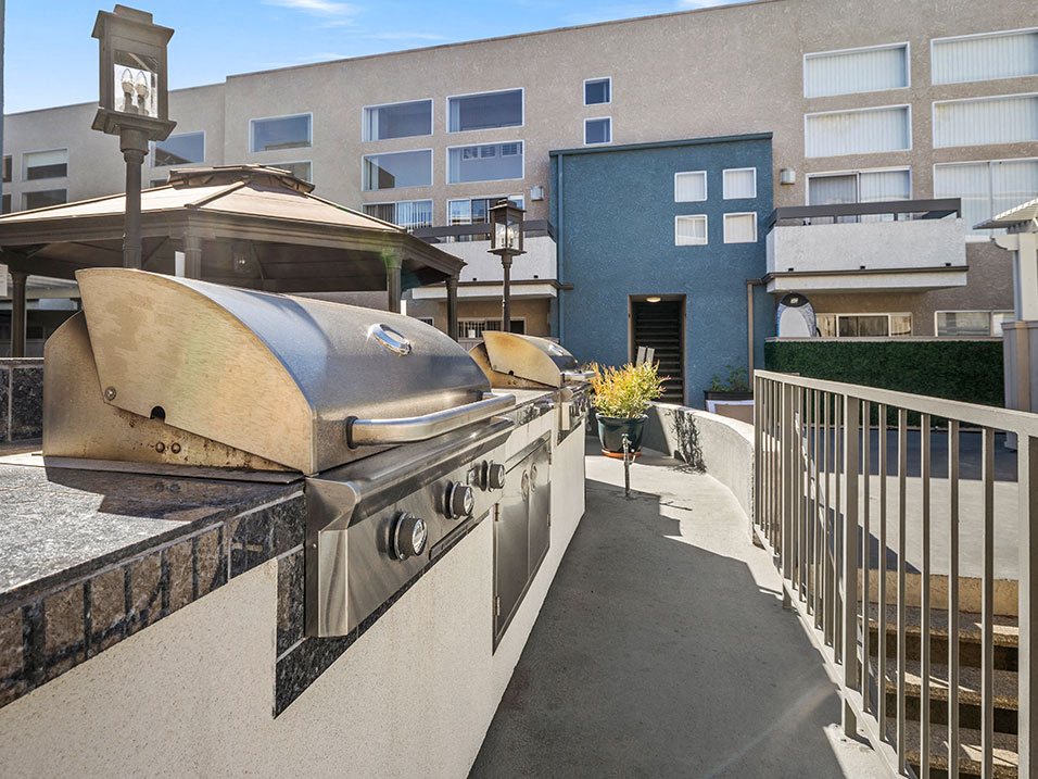 Courtyard BBQ and cooking area near large seating space