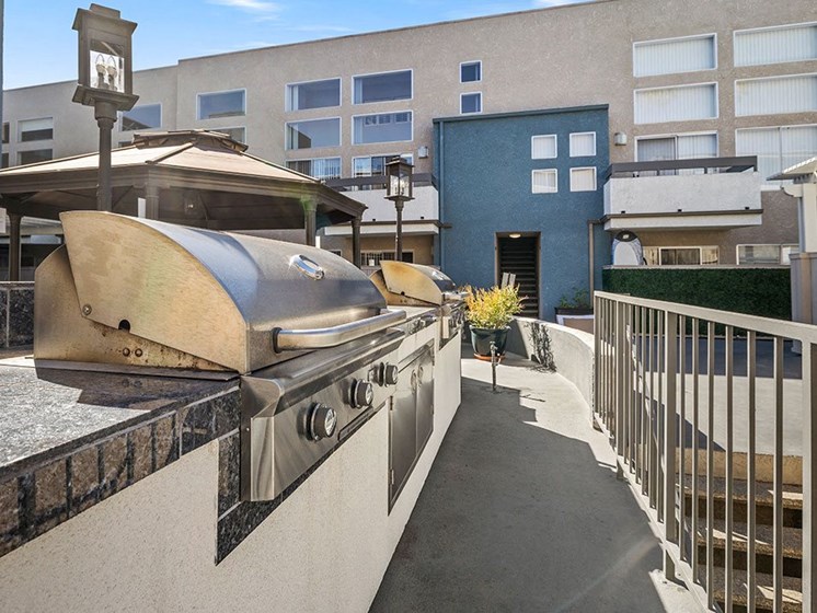 Courtyard BBQ and cooking area near large seating space