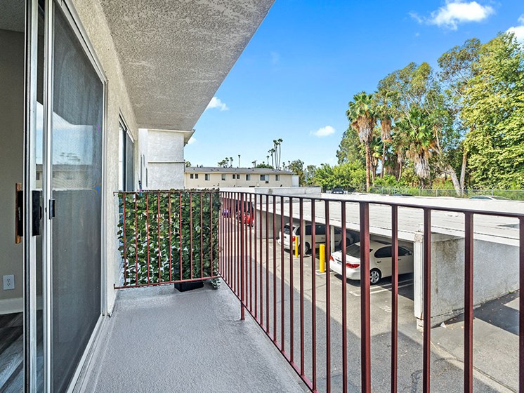 Private balcony overlooking covered parking area.