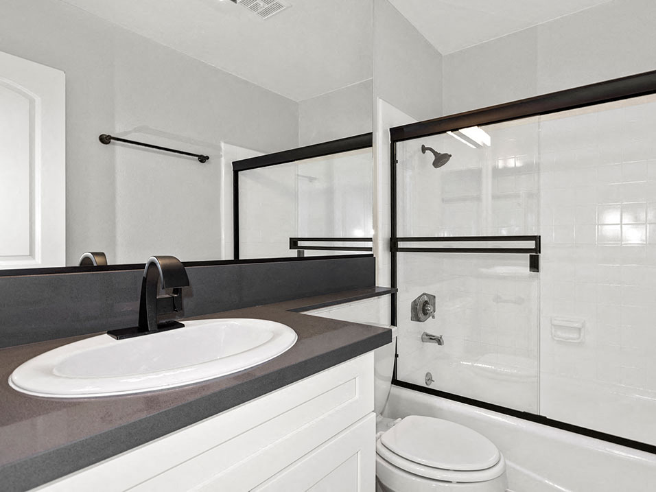 Modern styled bathroom with shower and tub.
