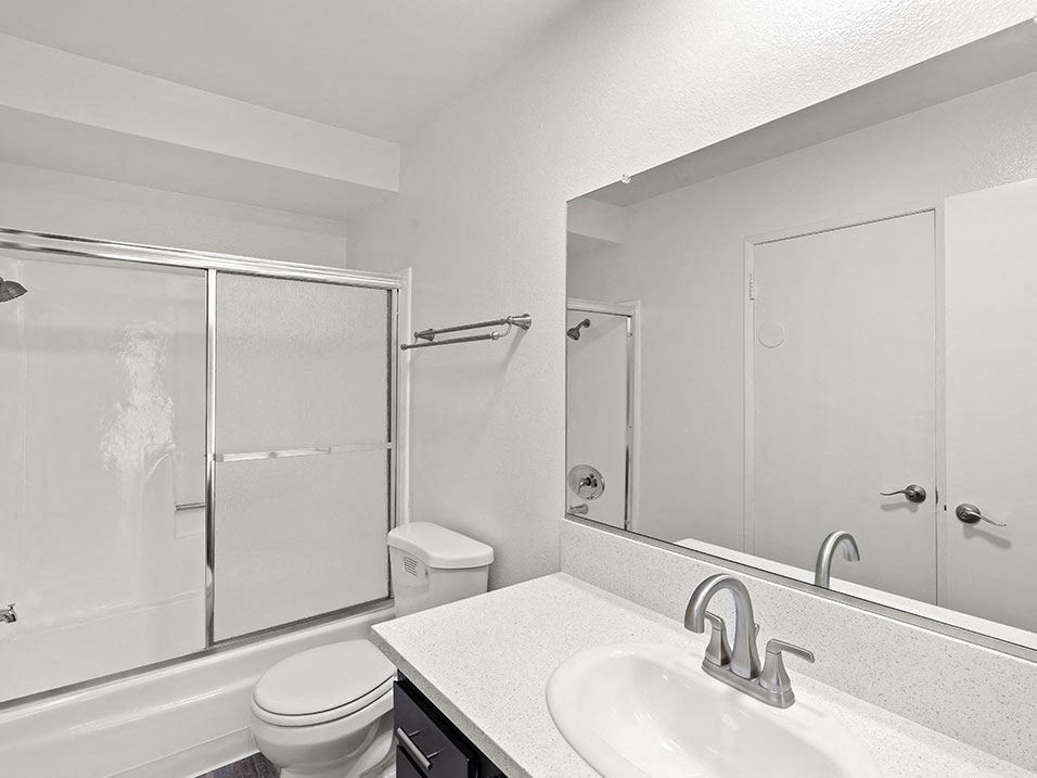 Modern styled bathroom with shower and tub.