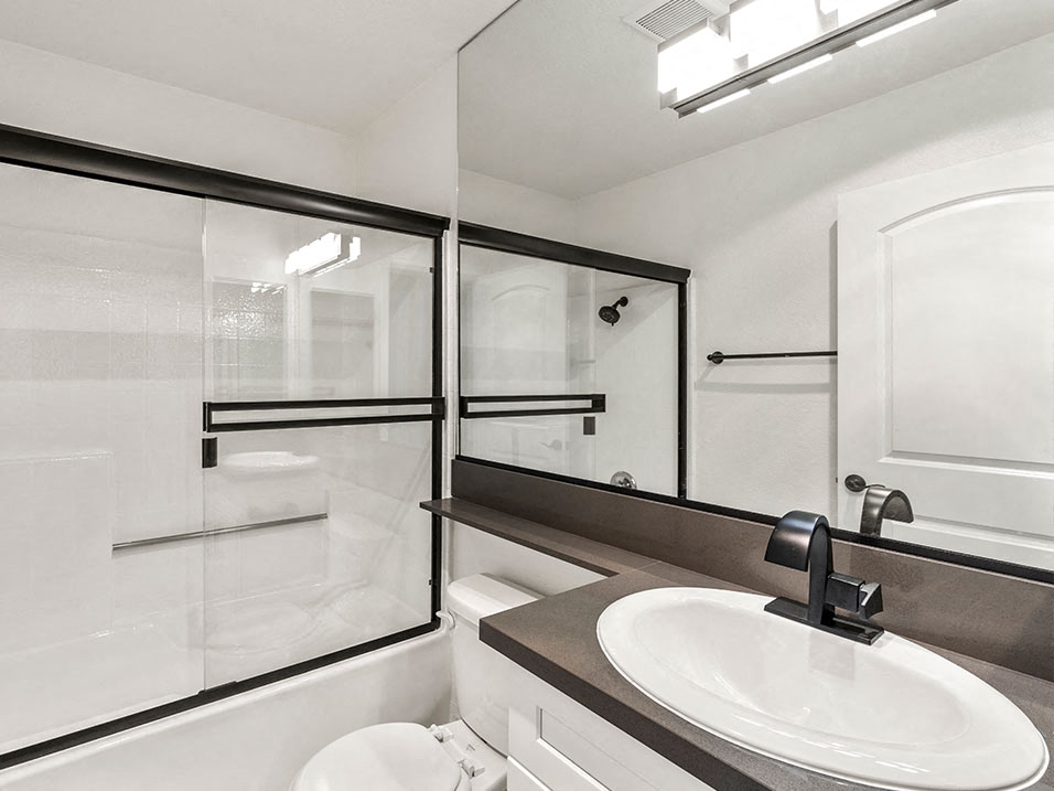Modern styled bathroom with shower and tub.