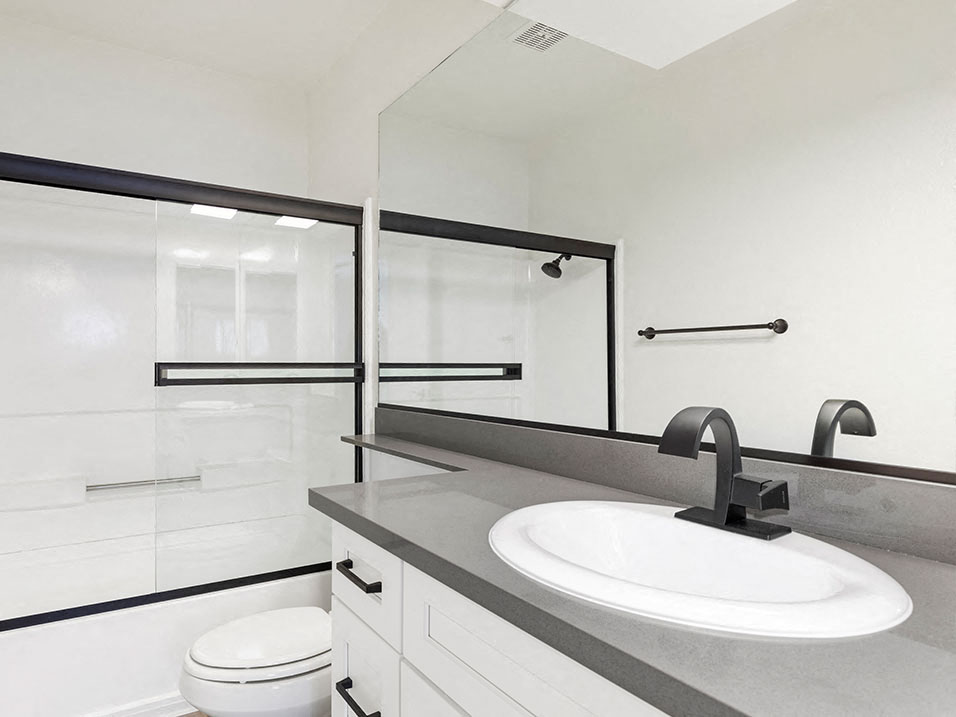 Modern styled bathroom with shower and tub.