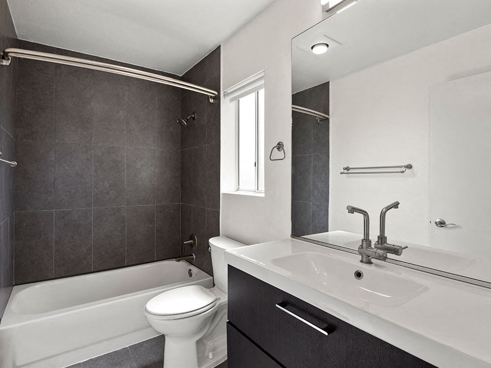 Modern styled bathroom with tub and shower.