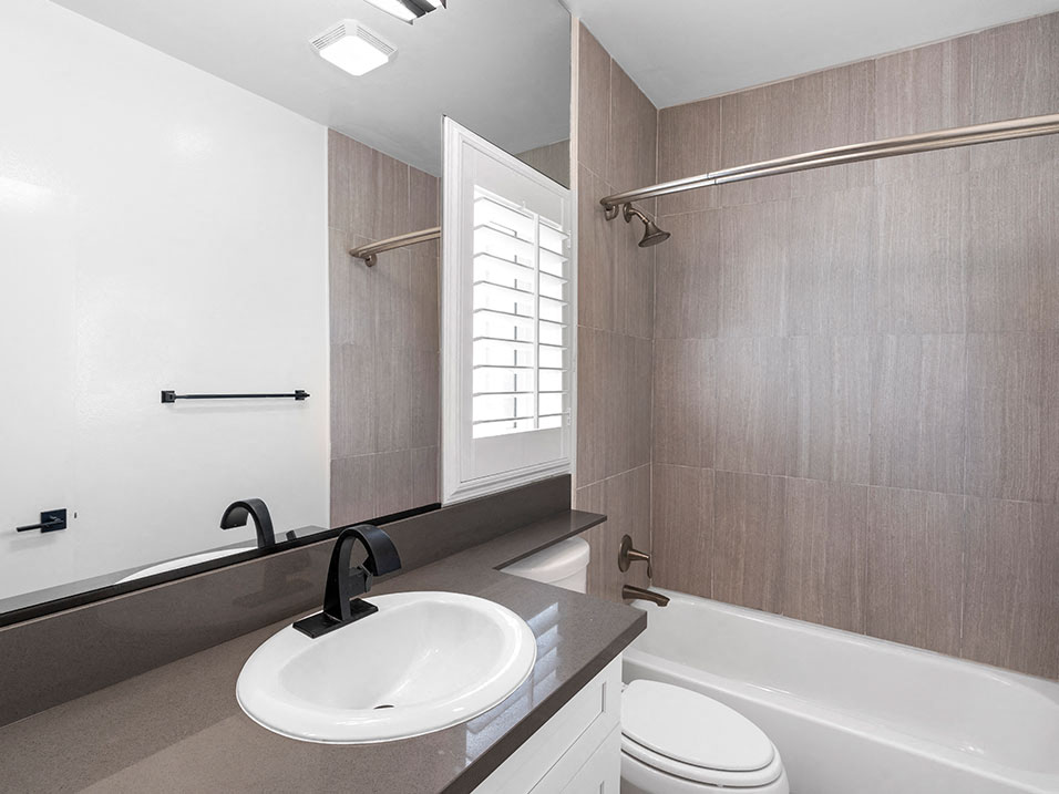 Modern styled bathroom with shower and tub.