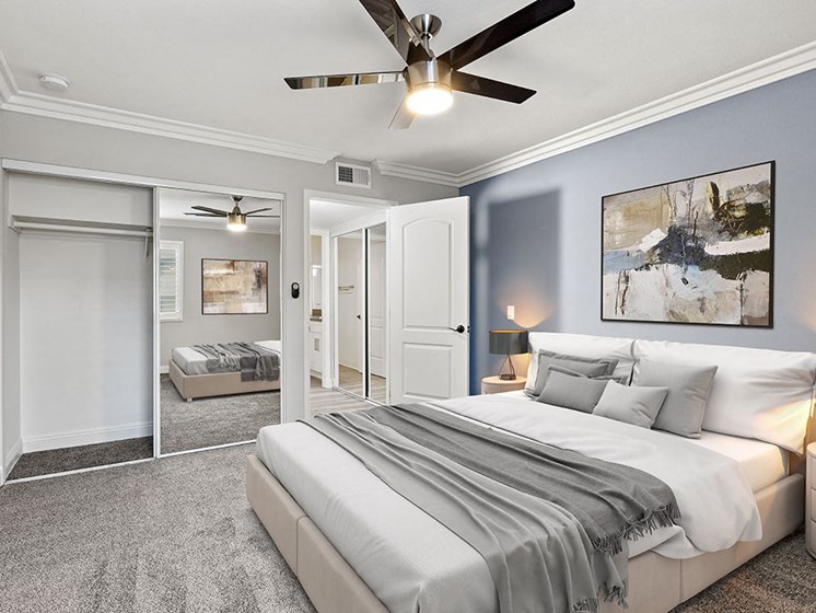 Large bedroom with ceiling fan.