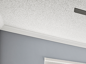 Carpeted bedroom with ceiling fan and large mirrored closets.