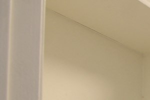 Walk in closet with ample storage, shelves, and hanging rods.