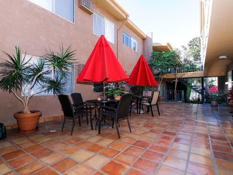 Courtyard with beautiful Spanish tile and community seating areas.