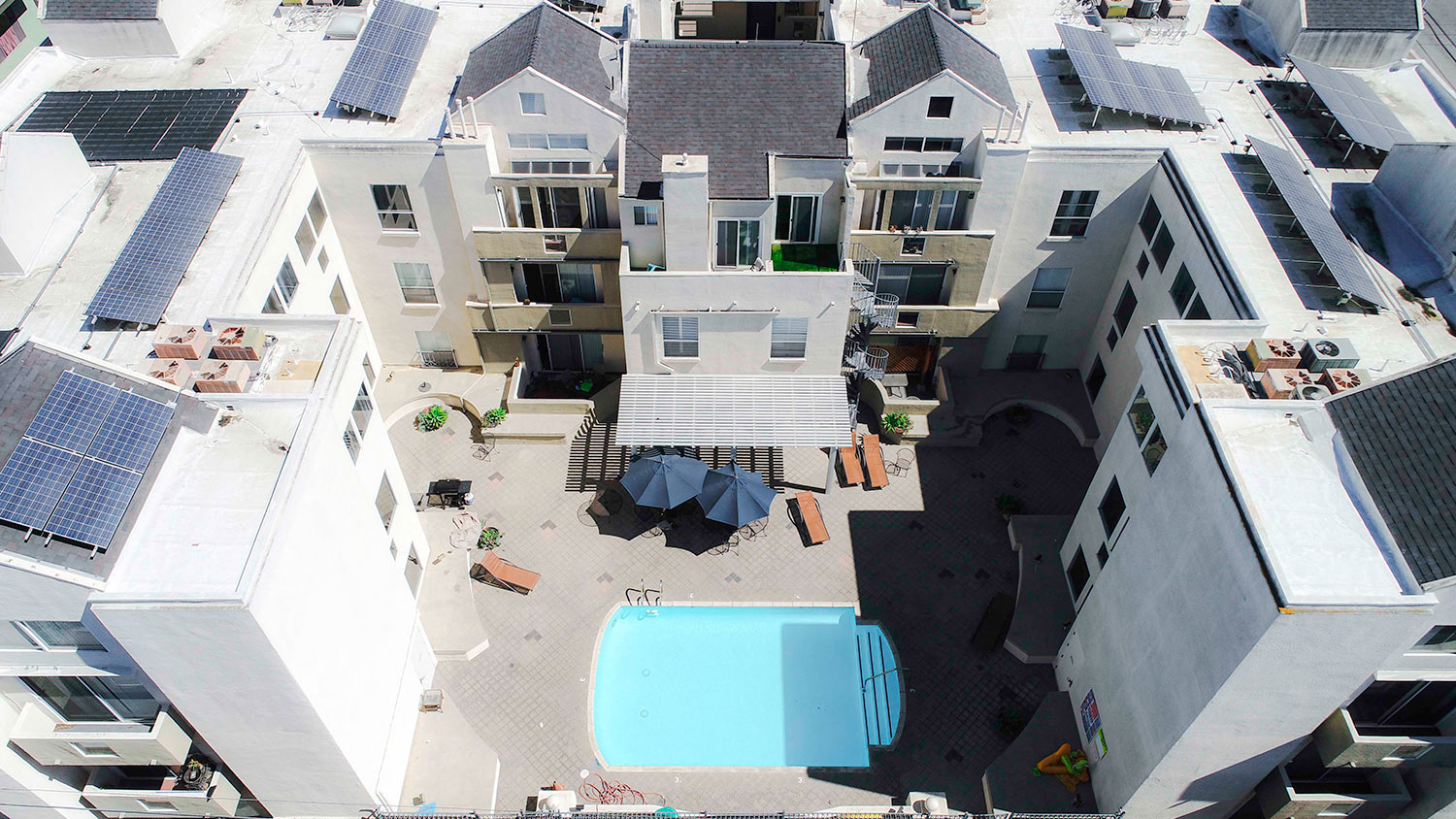 Drone image of the pool and roofs with white solar coating to lower our carbon footprint.