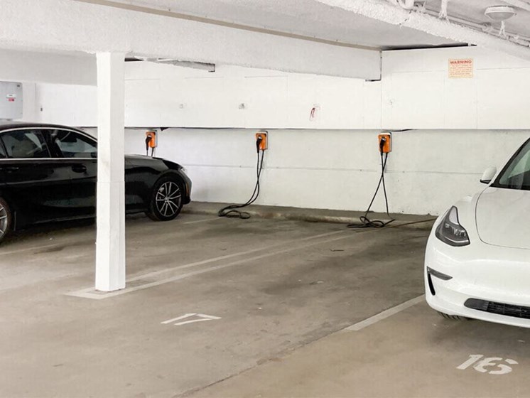 Large covered parking lot with EV Chargers.