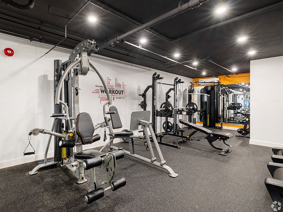 On-site fitness center with treadmills and weight machines.