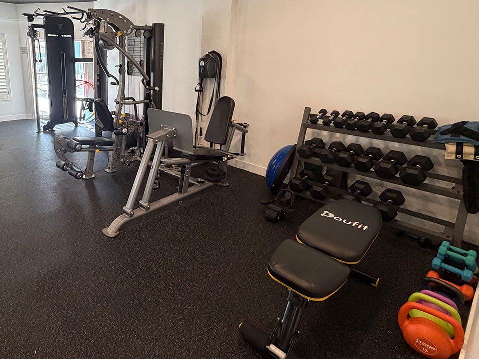 Fitness Center with Weight Machines and Free Weights.