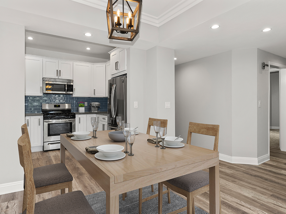 Hardwood floored dining room with view of kitchen.
