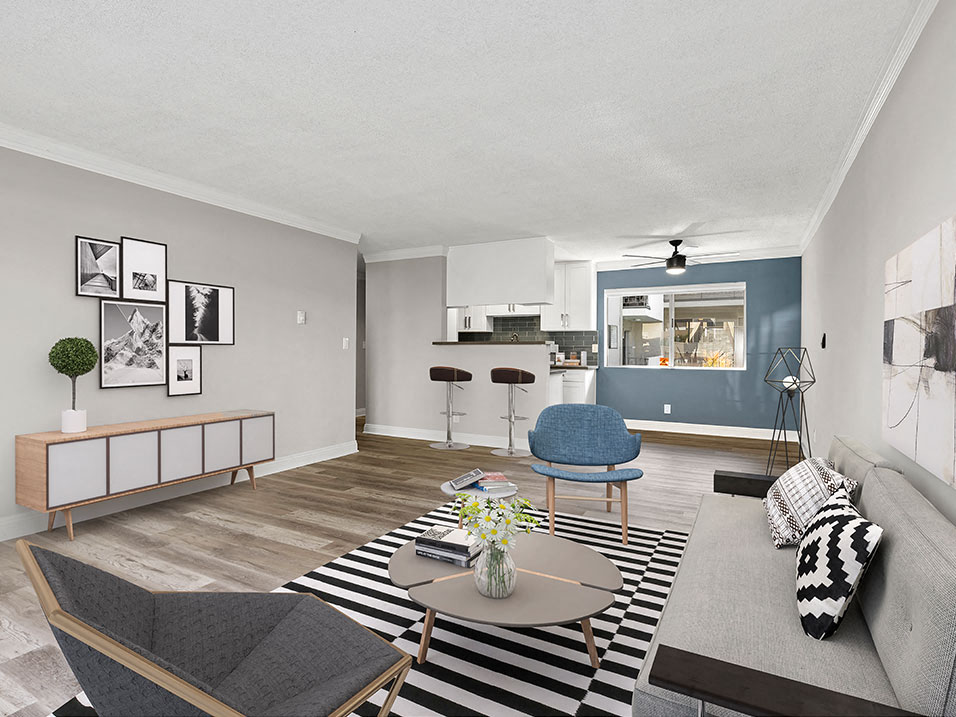 Living room with hardwood floors and blue accent wall.