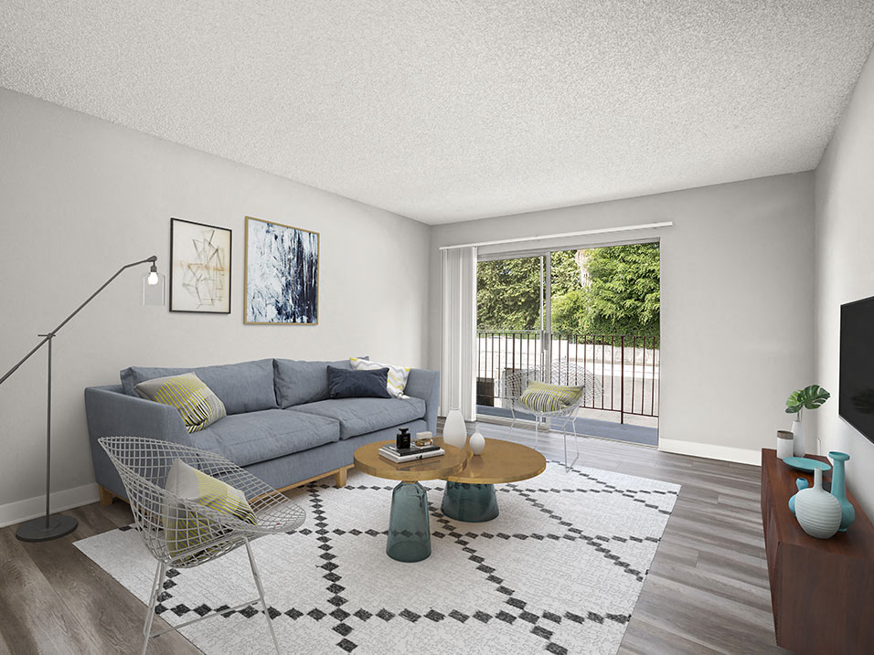 Hardwood floored living room with view of private patio.