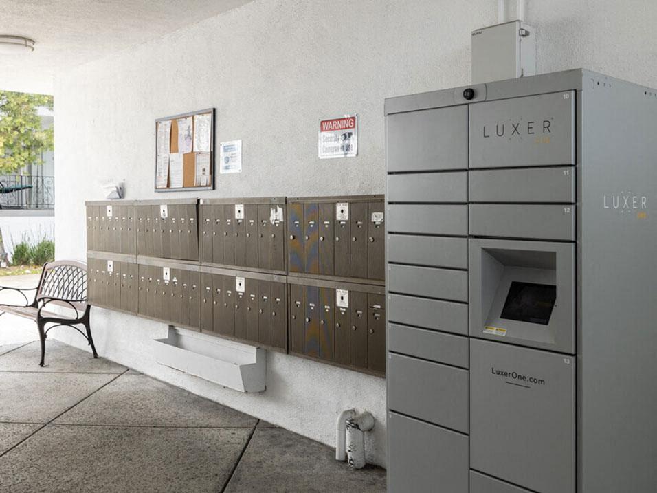 Mail area with Luxer package delivery lockers.