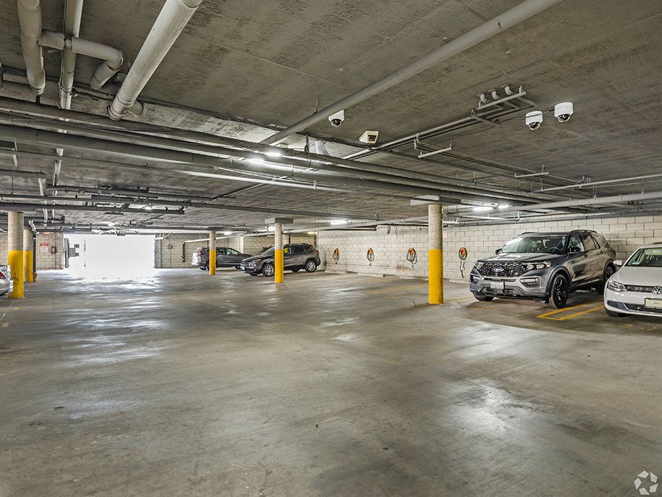 Large covered parking lot with assigned parking.