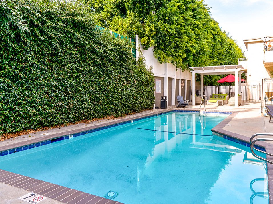 Community pool and lounging area at Woodridge Apartments.