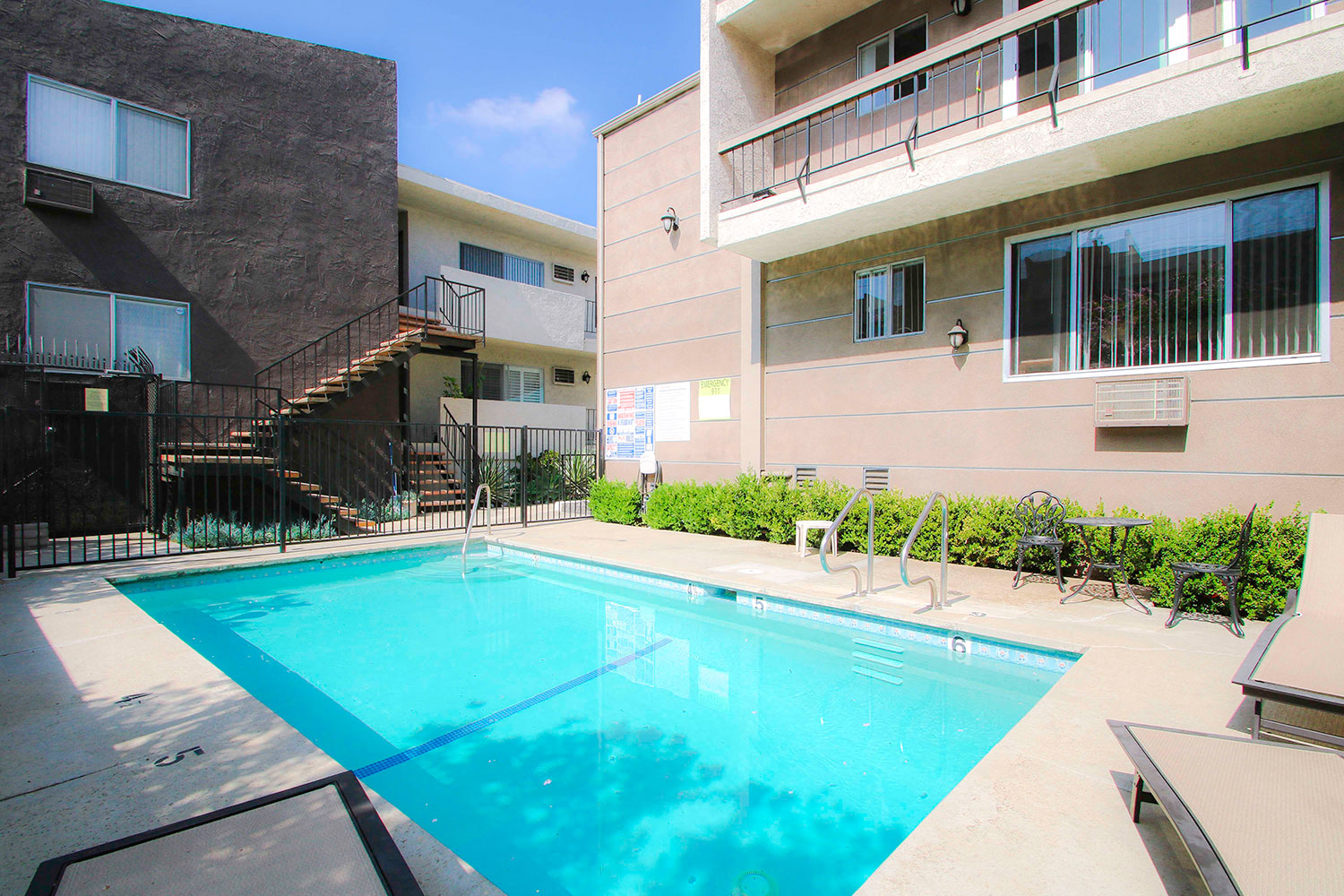 Beautiful courtyard pool with lounging space.