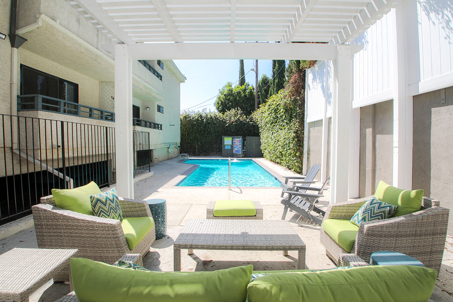 Community pool and lounging area at Woodridge Apartments.