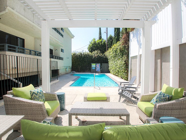 Community pool and lounging area at Woodridge Apartments.