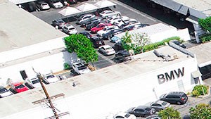 Aerial drone photo of Magnolia Terrace showing solar panels and energy-efficient white roof.