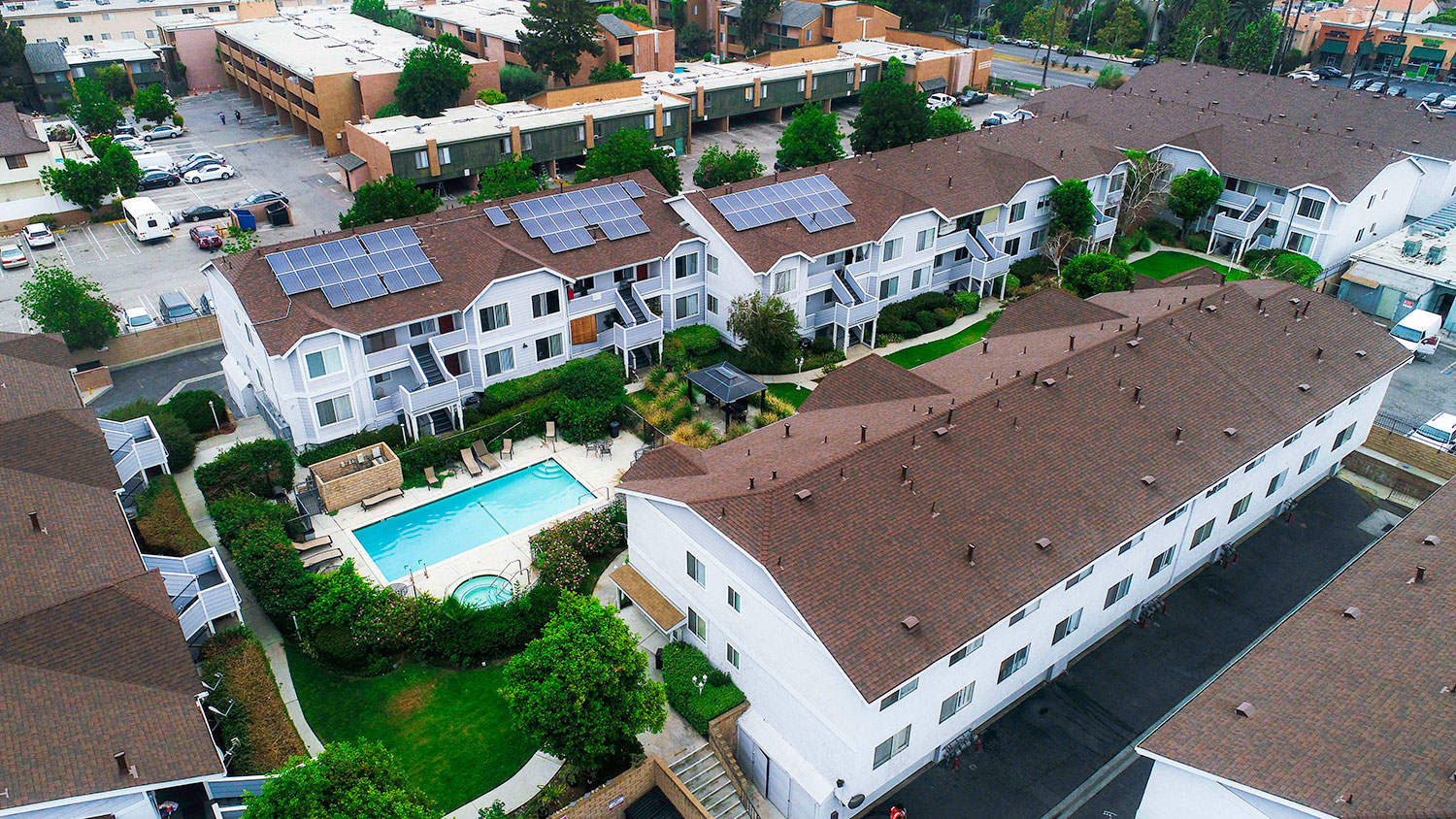Aerial drone view of roof showcasing solar panels for a low carbon footprint.