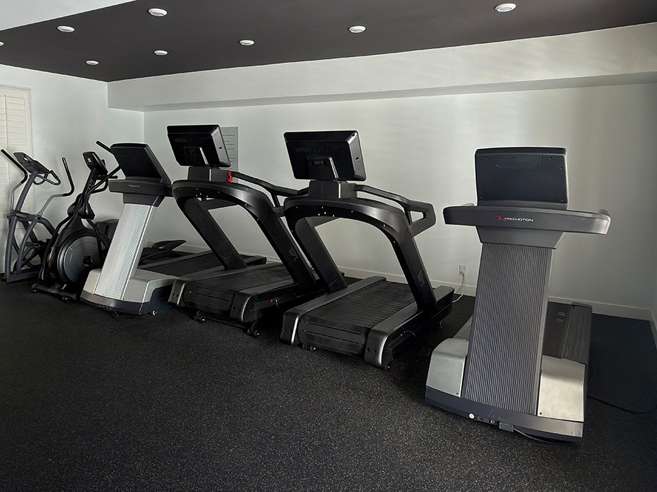Fitness Center with Treadmills and Free Weights.